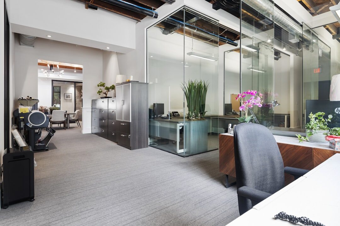 Bright modern office interior with desks and large windows