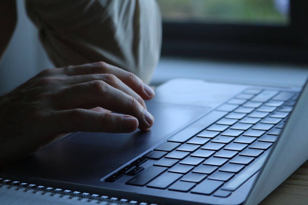 programmer coding on laptop